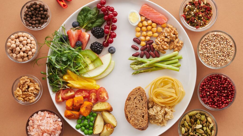 A white plate with a bunch of plant-based foods and ingredients