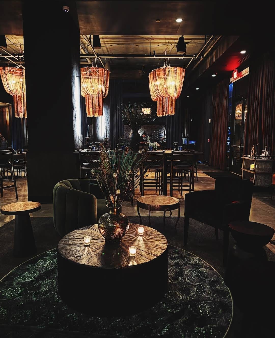 An image showcasing the interior of a restaurant with stunning modern luxury decor. The space is adorned with sleek furnishings, contemporary artwork, and stylish lighting fixtures.