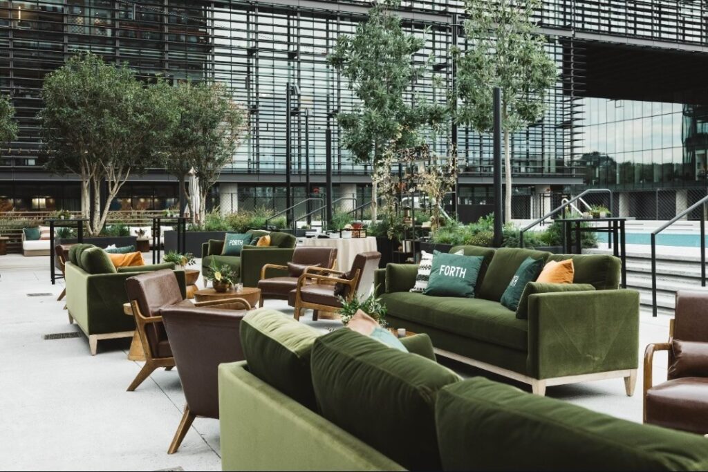 Patio furniture setup outside of FORTH Atlanta Hotel.