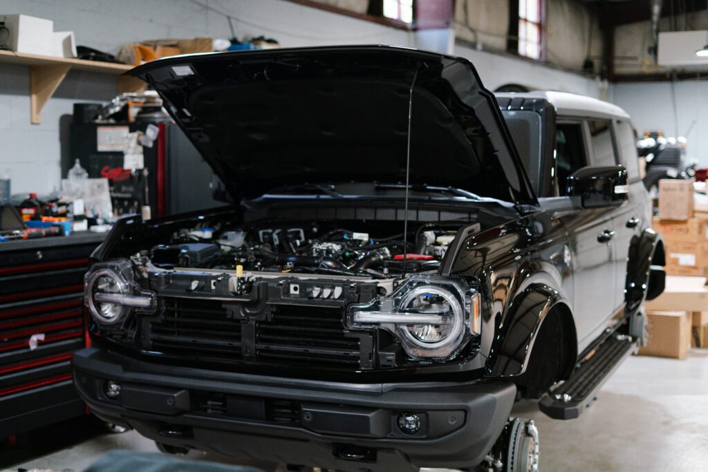 Custom Ford Bronco mid-build at Elite Customs’ shop — a behind-the-scenes look at their tribute project for Bunnie XO.