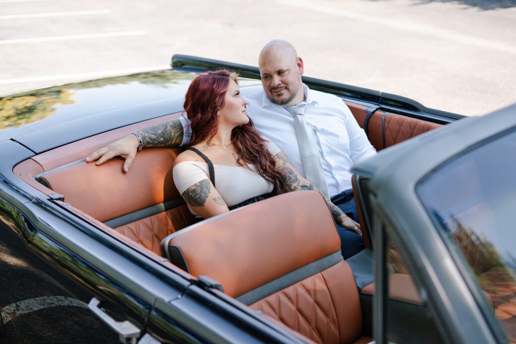 Founders Sam and Rich of Elite Customs inside a bespoke luxury convertible — a portrait of craftsmanship, style, and self-expression in motion.