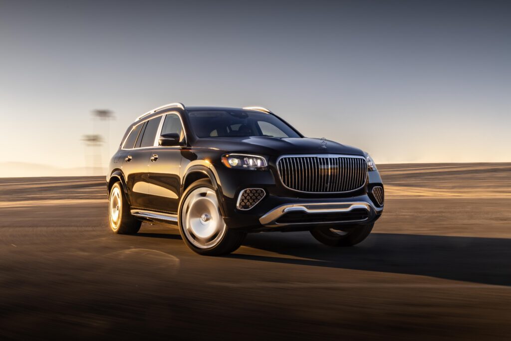 2025 Maybach GLS luxury SUV driving on the open road, showcasing performance and design.