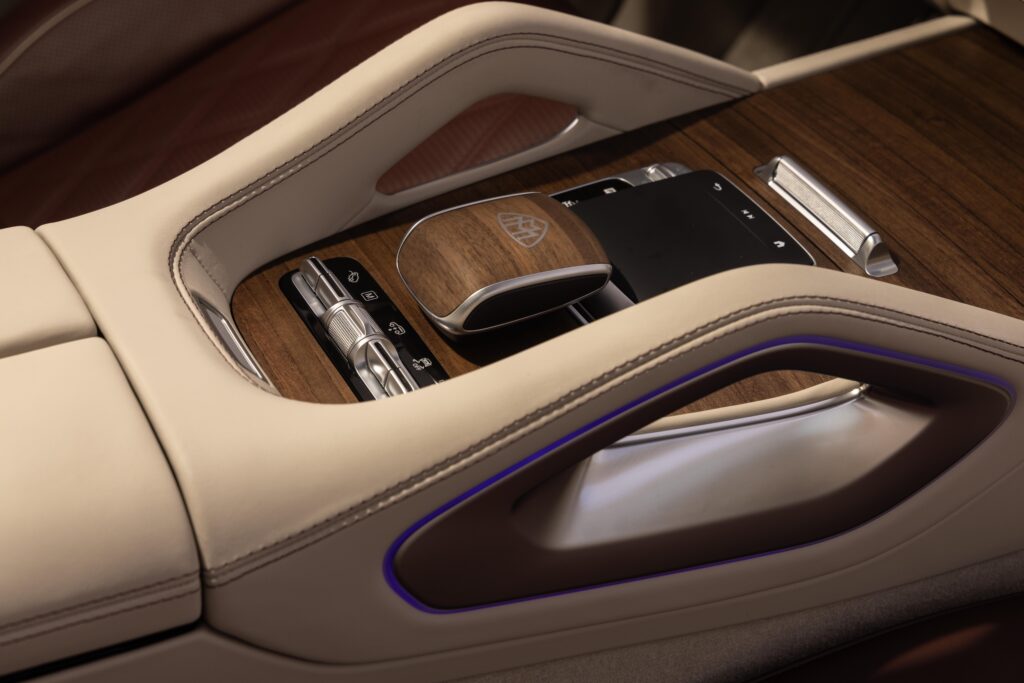 Center console with premium wood trim and luxury control switches.