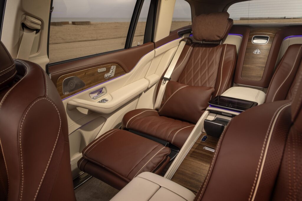 Rear reclining executive seats with premium brown leather upholstery.