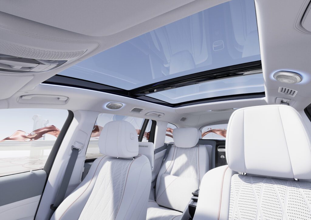 White leather interior with panoramic sunroof and spacious cabin design.